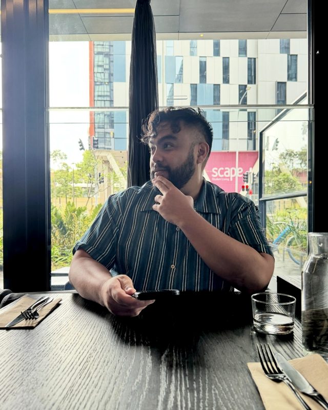 Nalu Camanse, founder of Lonely Pine AI, at a cafe window in Tokyo